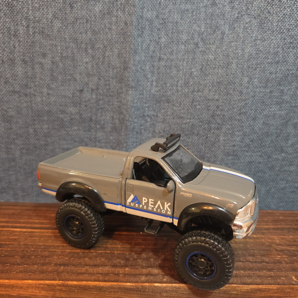 First Gear Custom Ford F-250 Lifted Peak Suspension Diecast Off-Road