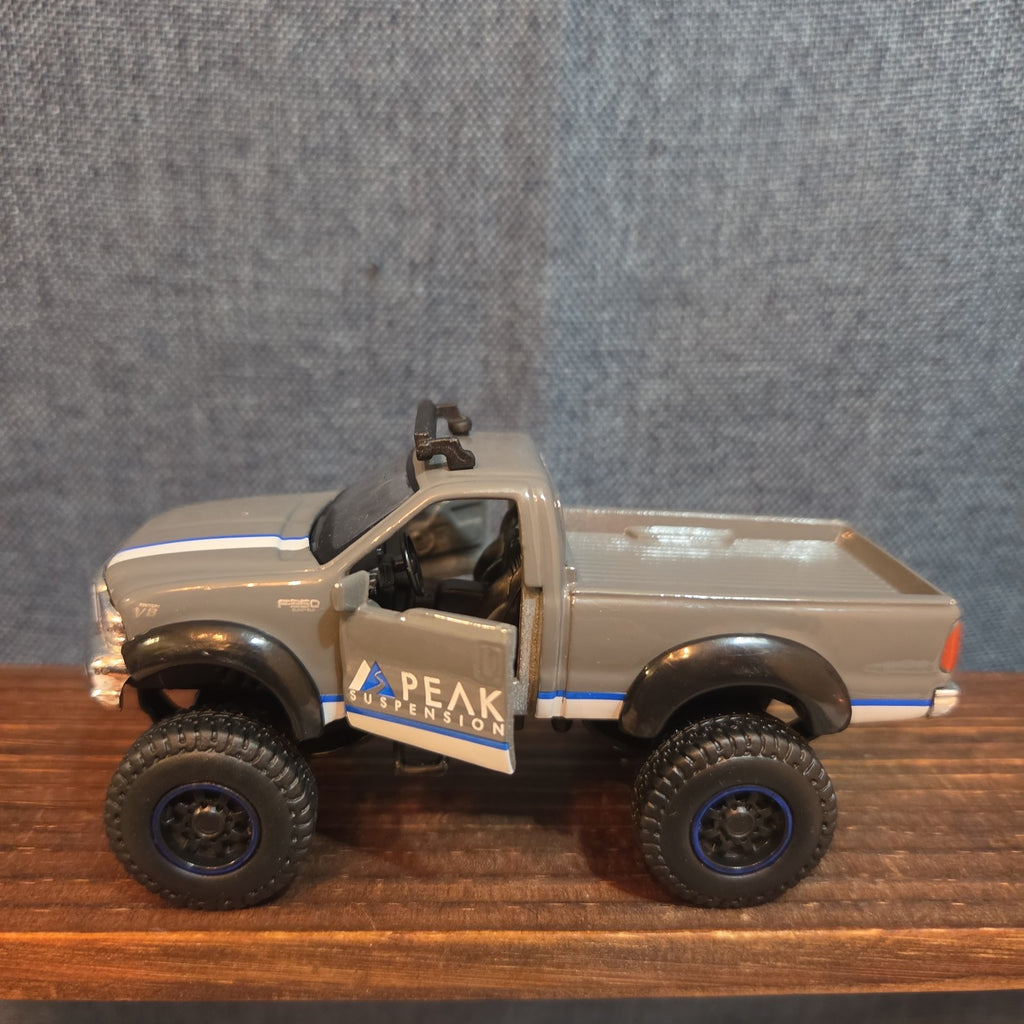 First Gear Custom Ford F-250 Lifted Peak Suspension Diecast Off-Road