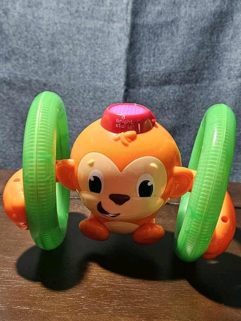 Bright Starts Roll & Glow Monkey | Musical Light Up Crawl Toy | Tummy Time Toy