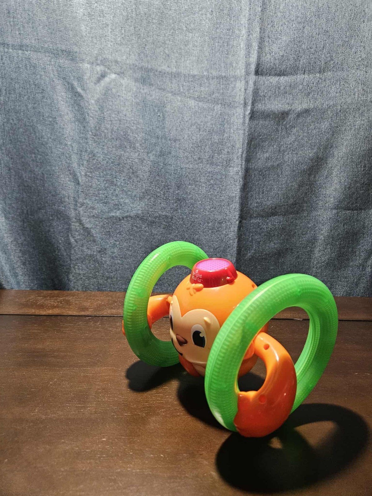 Bright Starts Roll & Glow Monkey | Musical Light Up Crawl Toy | Tummy Time Toy