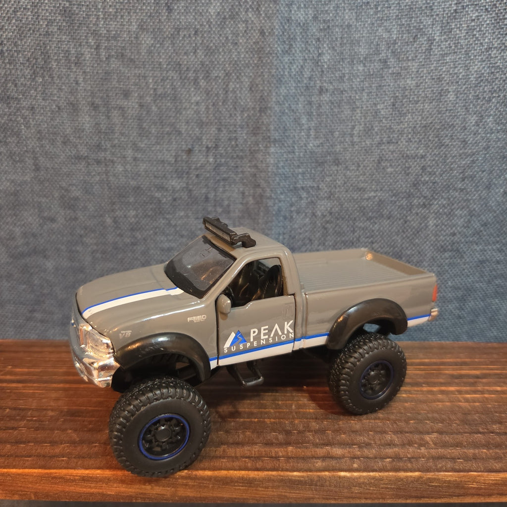 First Gear Custom Ford F-250 Lifted Peak Suspension Diecast Off-Road