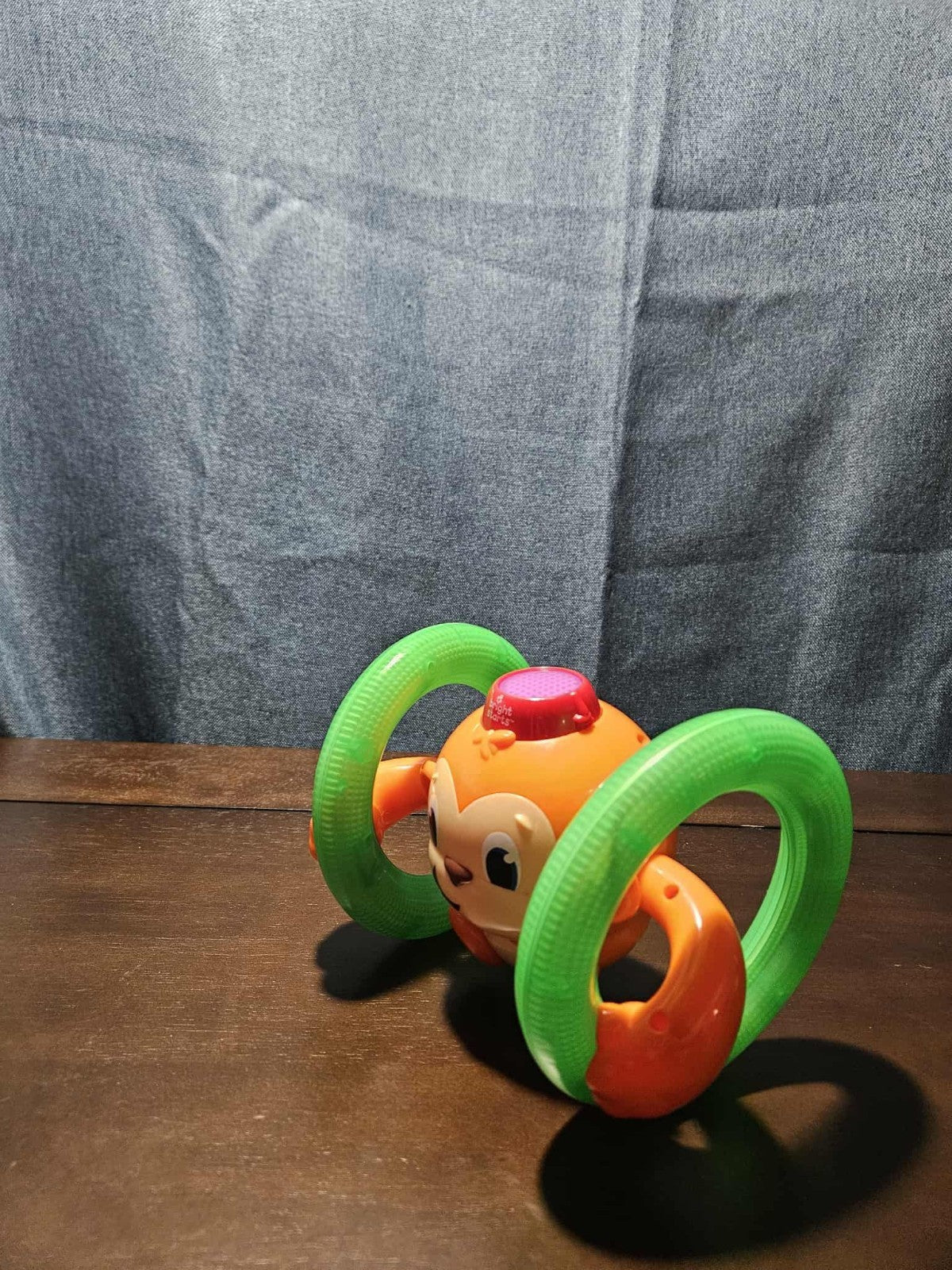 Bright Starts Roll & Glow Monkey | Musical Light Up Crawl Toy | Tummy Time Toy