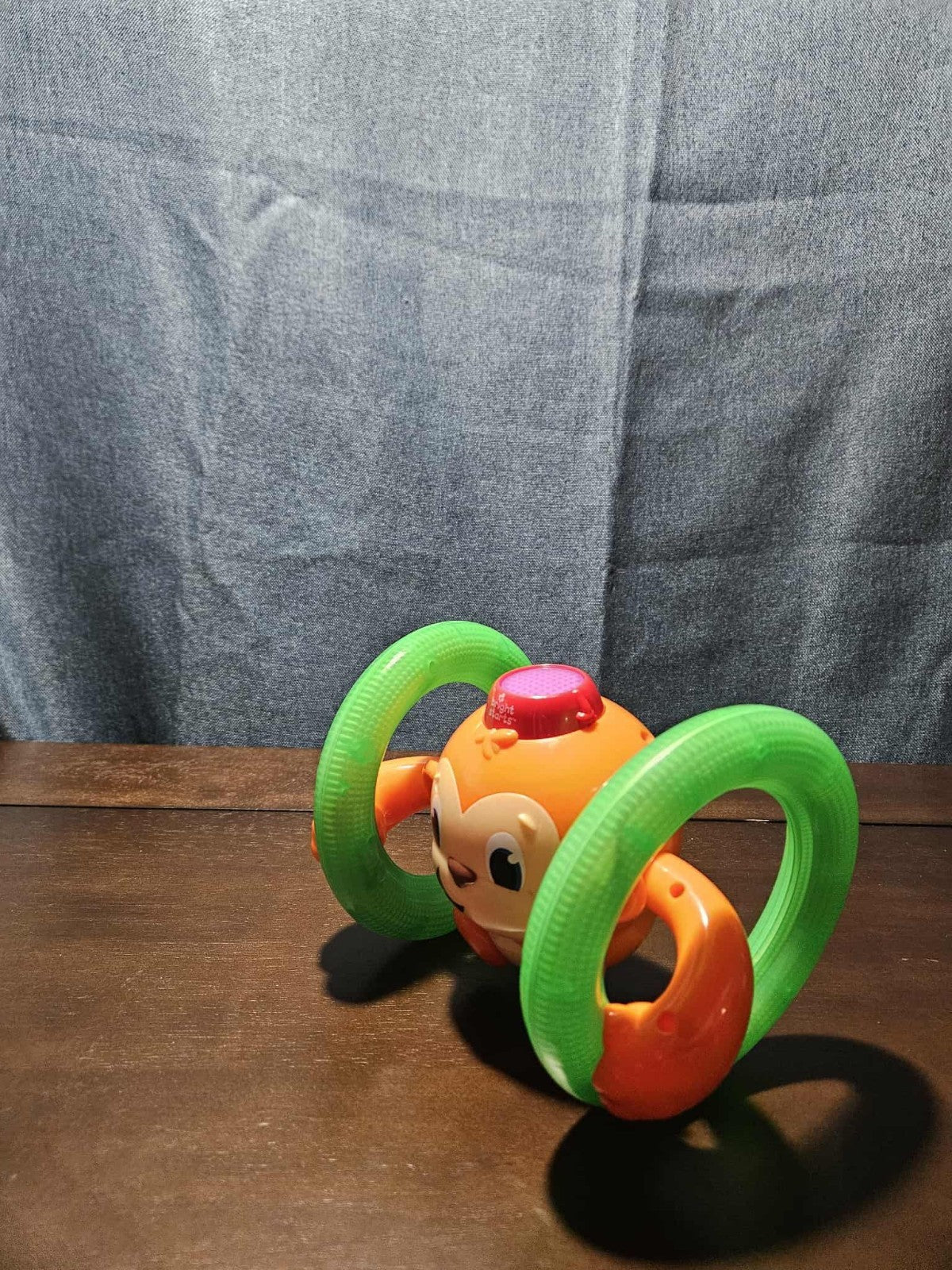 Bright Starts Roll & Glow Monkey | Musical Light Up Crawl Toy | Tummy Time Toy