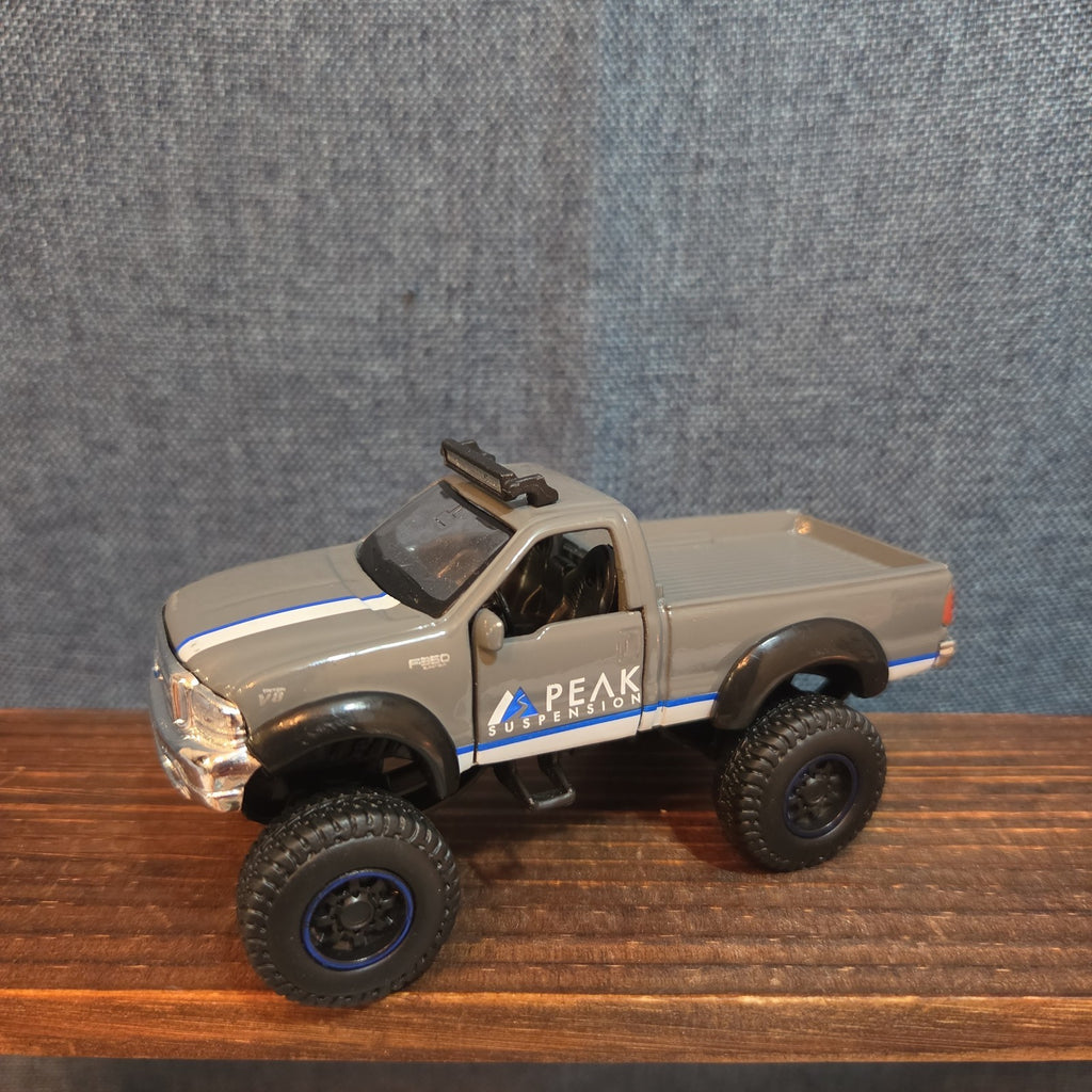First Gear Custom Ford F-250 Lifted Peak Suspension Diecast Off-Road