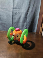 Bright Starts Roll & Glow Monkey | Musical Light Up Crawl Toy | Tummy Time Toy