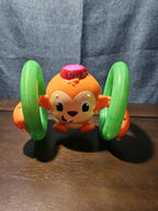 Bright Starts Roll & Glow Monkey | Musical Light Up Crawl Toy | Tummy Time Toy