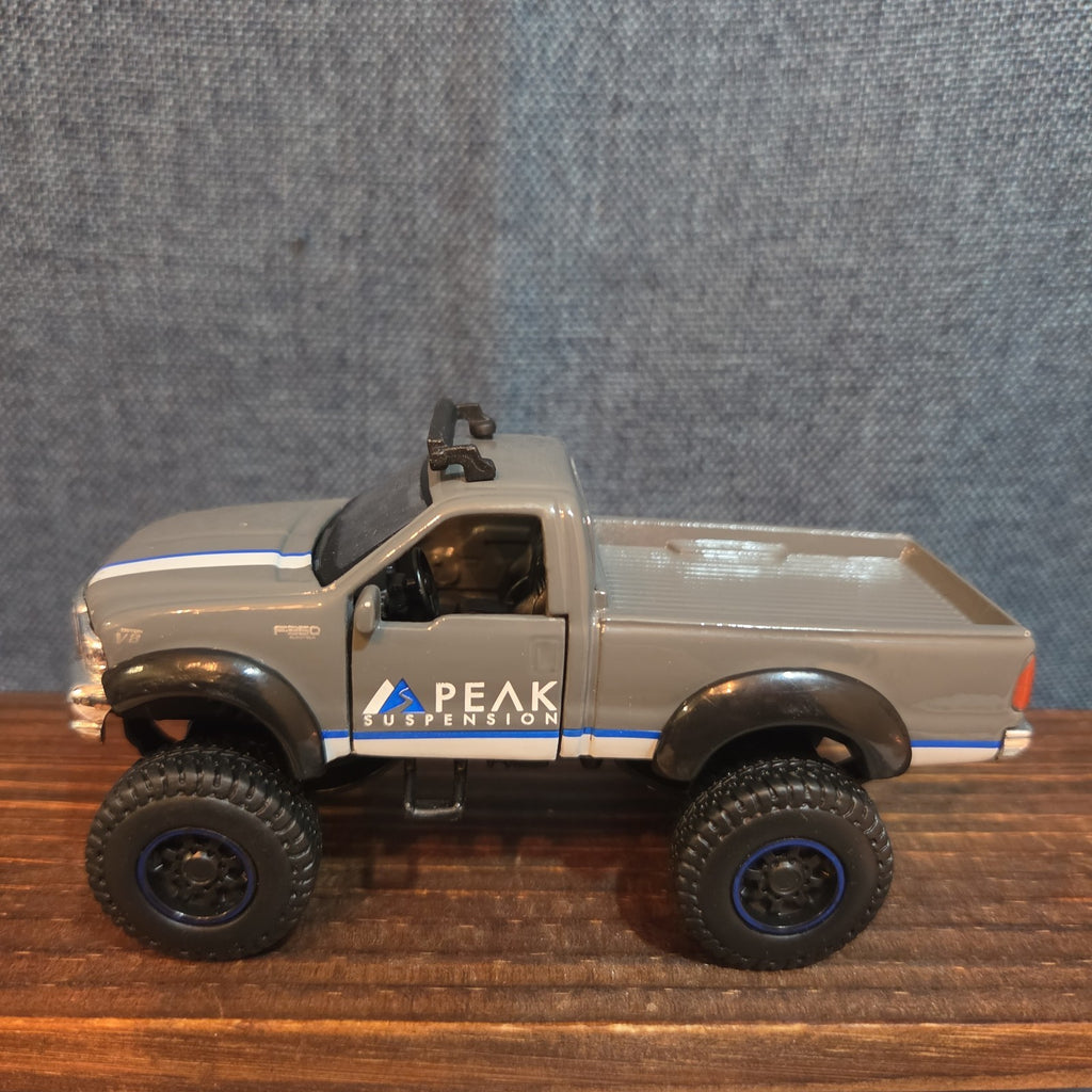 First Gear Custom Ford F-250 Lifted Peak Suspension Diecast Off-Road
